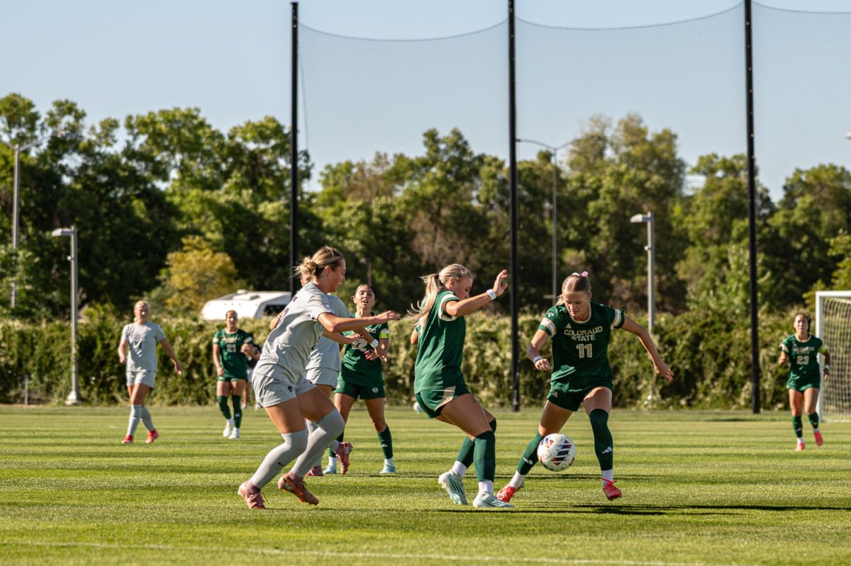 Skylar Alonso (1) makes a small pass toward her teammate, Hanna McKay (11) in the match against Kansas State in the CSU Soccer Fields Sept. 10.