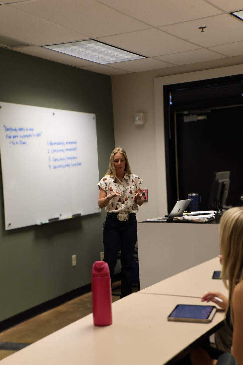 Maggie Murphy, Ph.D., explains a topic to her Horse Judging Team students, Sept. 23.