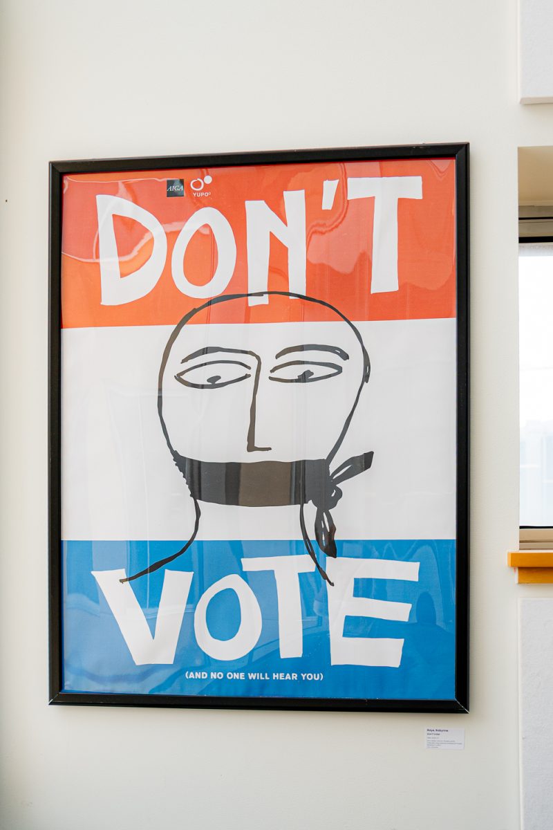 A poster reading “Don’t vote,” created by Robynne Raye, is displayed as part of the "We the People: Voices of Democracy" exhibit in the second floor of the Morgan Library Sept. 28. 
