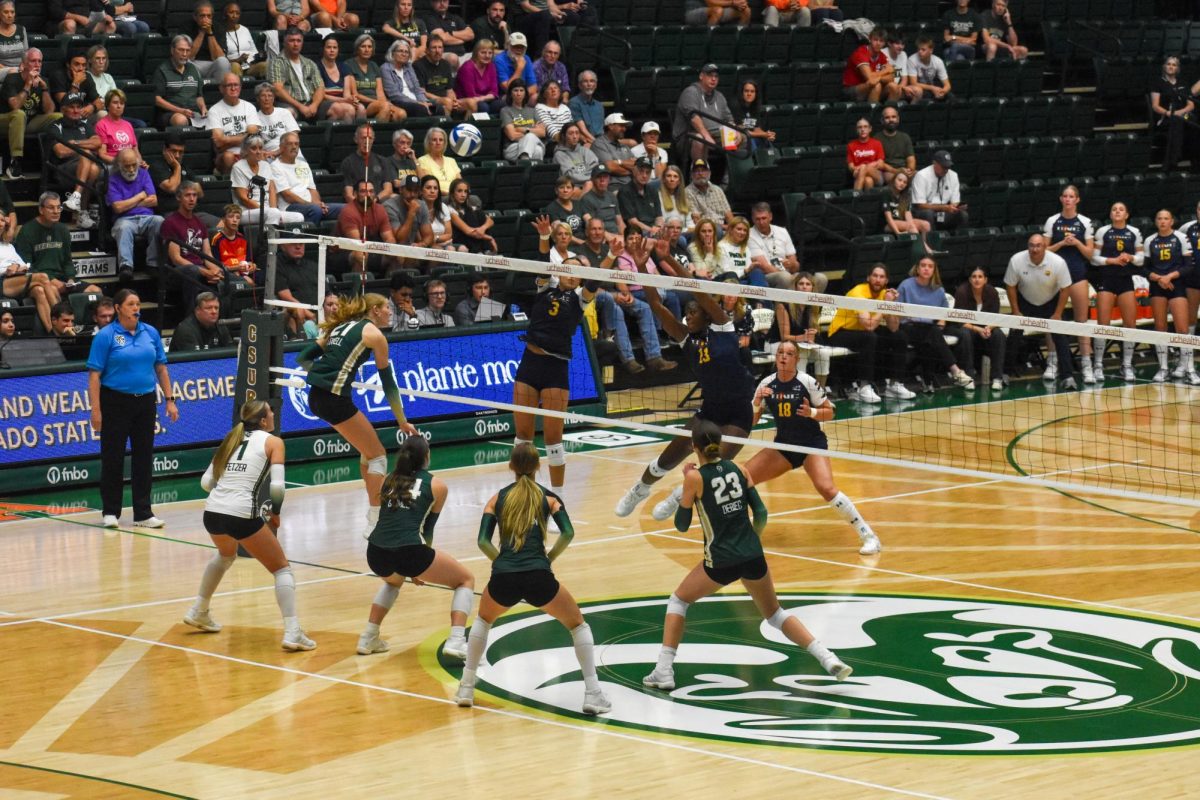 Colorado State outside hitter Ella Stowell (21) jumps up to spike the ball against the Northern Colorado Bears at Moby Arena Sept. 1.