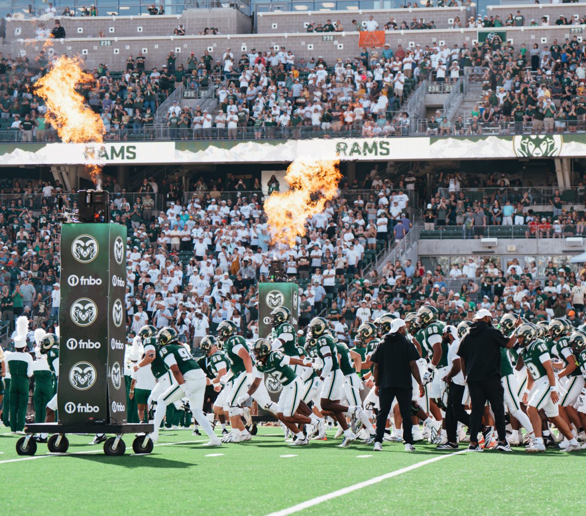 The Colorado State University football team rushes onto the field to start the Border War game against the University of Wyoming Sept. 5. CSU won 35-15.