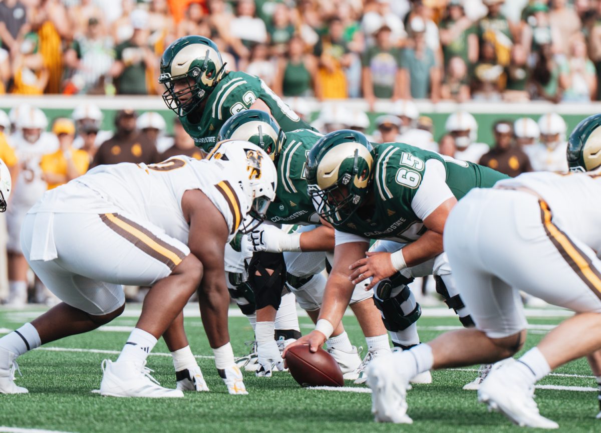 Phillip Ocon (65) prepares to set the ball in the Colorado State University vs. Wyoming border war game Sept. 5.