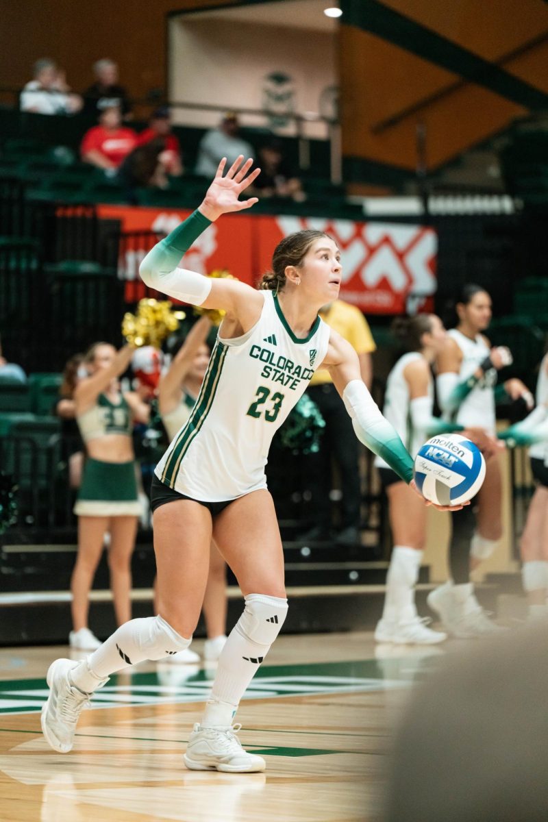 Erin Debiec (23), a player for Colorado State University's volleyball team, prepares to serve the ball during the final set against the University of South Dakota  Sept. 10. CSU beat  SDSU 3-0.