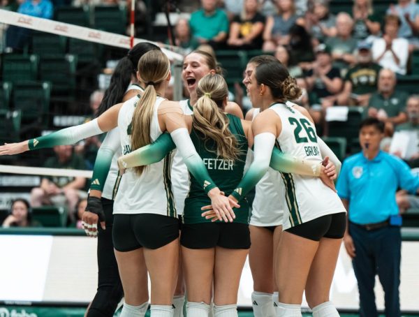 Colorado State University volleyball players celebrate their first point in their match against the University of South Dakota Sept. 10. CSU beat USD 3-0.