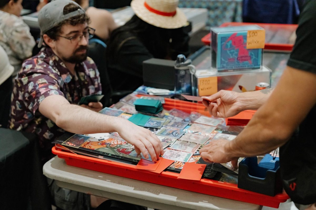Mitchell Gagnon (left) plays Dan Lisacano (right) in a game during the NoCo Collector Con at The Drake Centre Sept. 5.