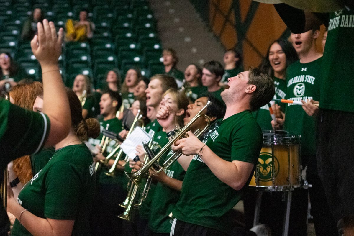 Members of the Colorado State University Presidential Pep Band sing the chorus to "Hey! Baby" during a volleyball matchup between CSU and Oregon State University in Moby Arena Oct. 10. After a close loss in the first set, CSU volleyball fought back to win the game in four sets.