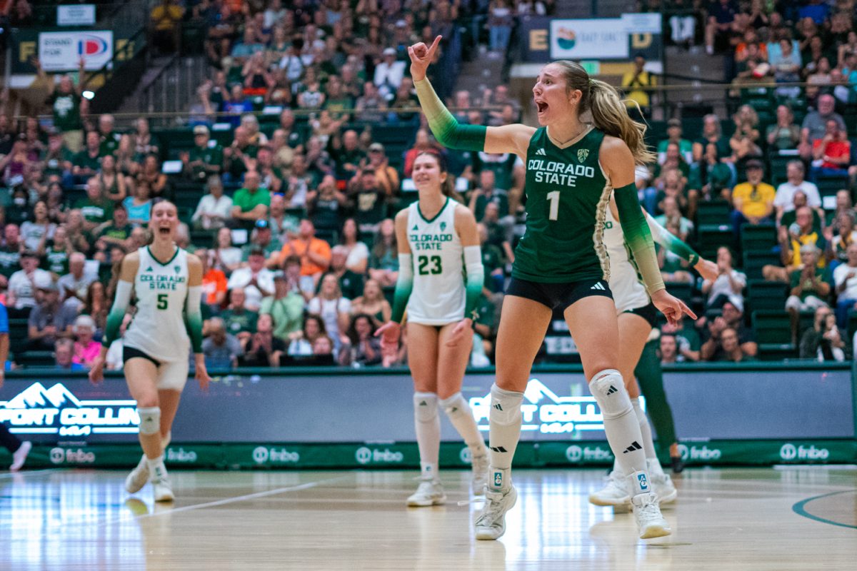 Karsyn Fetzer (1), a libero for Colorado State University volleyball, holds up a finger to celebrate a point made on an Oregon State University service error during a Rams home game Oct. 10. OSU made 31 service errors over the course of four sets.
