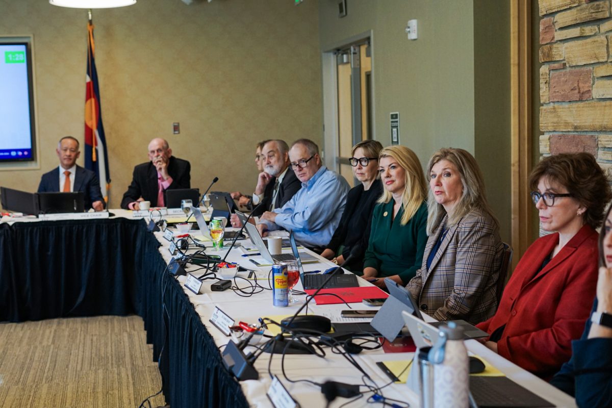 Members of the Colorado State University Board of Governors listen as community members address them during the public comment section of a board meeting in the Lory Student Center Oct. 1.