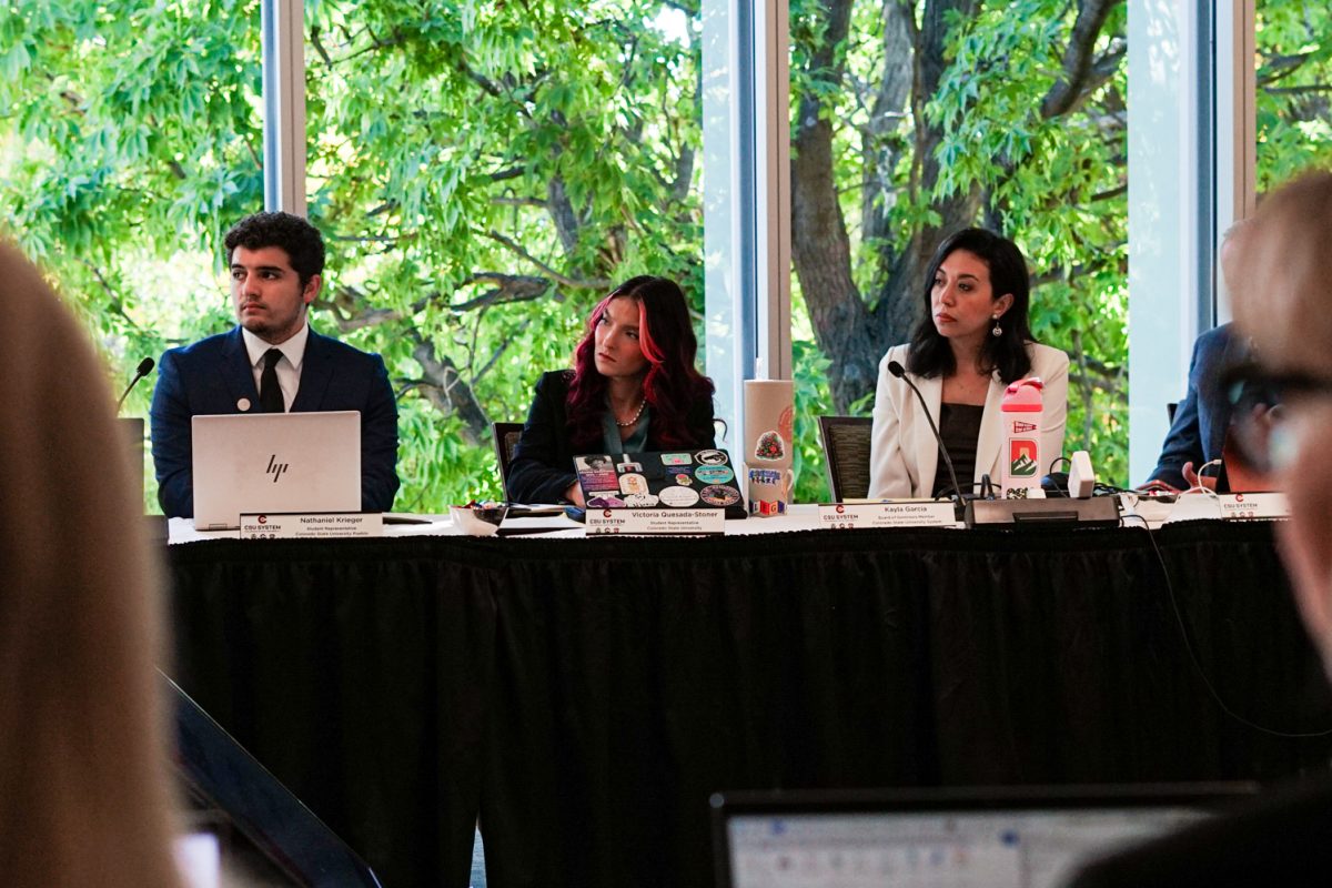 Nathaniel Krieger, Associated Student Government president at Colorado State University Pueblo, Victoria Quesada-Stoner, president of the Associated Students of CSU, and Kayla Garcia, a voting member of the CSU Board of Governors, listen and take notes as community members address the board during the public comment section of the meeting in the Lory Student Center Oct. 1.