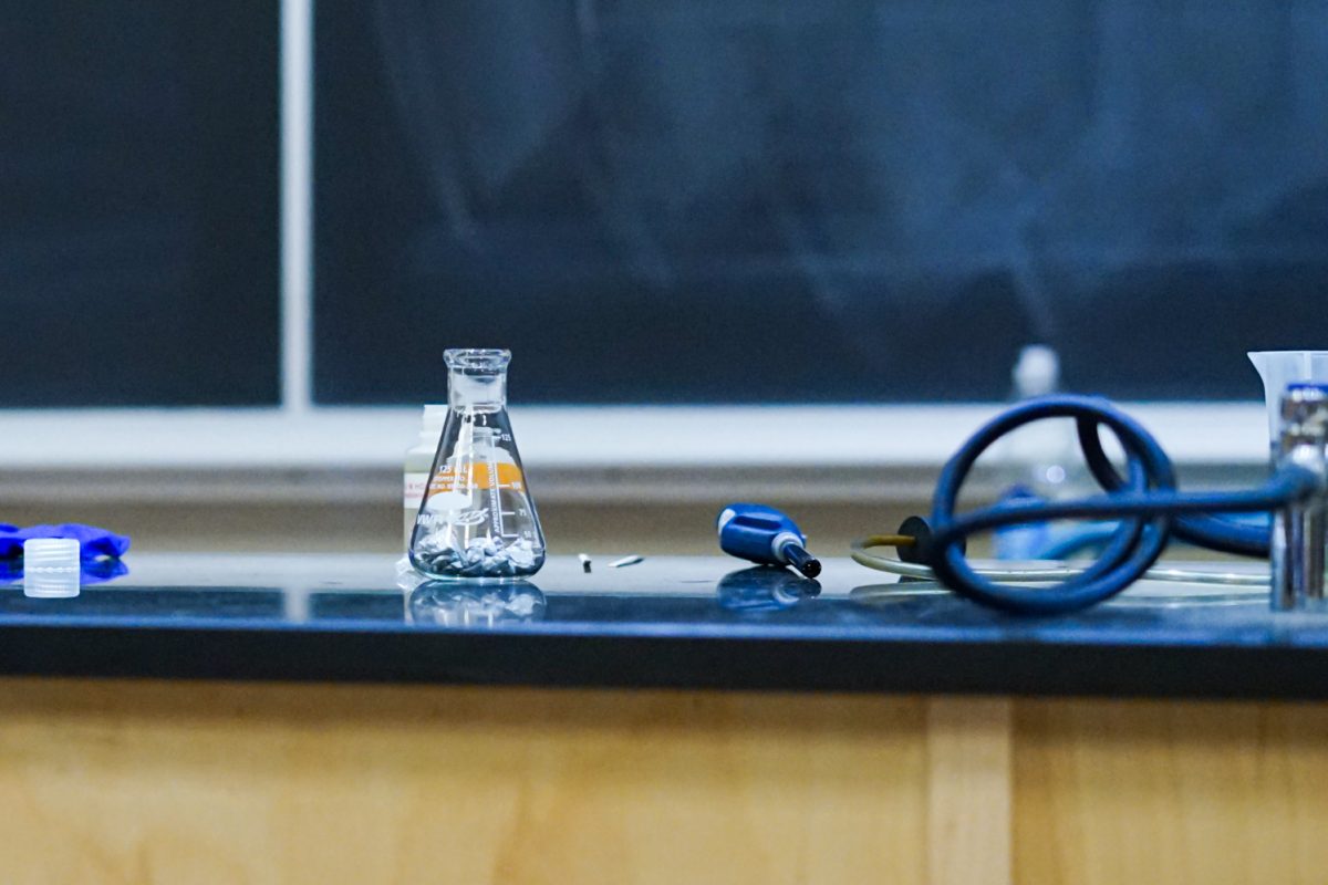 A beaker and a lighter sit on a table before a demonstration in the Chemistry building Oct. 1.