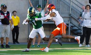 Colorado State University running back Mel Brown (1) stiff-arms an Oregon State University defender during their game at Canvas Stadium Oct 3.