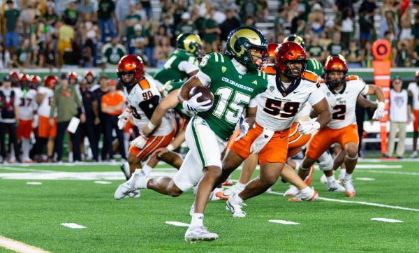 Colorado State University wide receiver Terrance Smith Jr. (15) carries the ball during CSU's game against Oregon State University at Canvas Stadium Oct. 3. Smith's longest reception was 13 yards, and he caught two passes from quarterback K'saan Farrar (2) for a 100% catch rate.