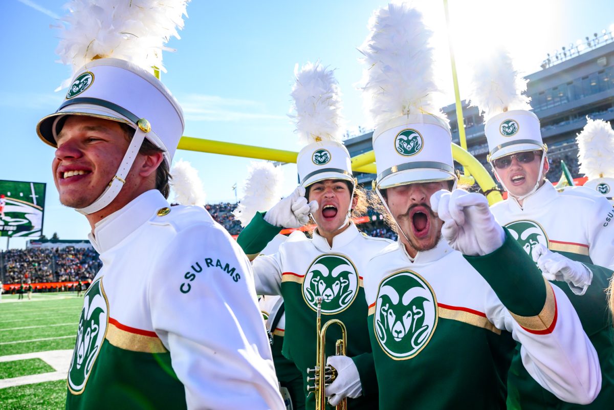 Members of Colorado State University's Marching Band pose for a photo while walking off the field before CSU's Homecoming game against Oregon State University Oct. 3.