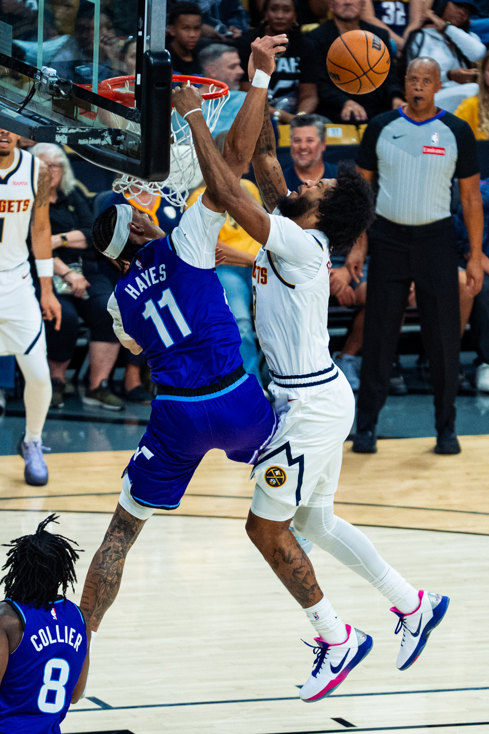 Utah Jazz center Jaxson Hayes (11) blocks a dunk attempt from Denver Nuggets forward Marvin Bagley III (3) during a preseason game between the Jazz and the Nuggets at the CU Events Center Oct. 4. Bagley and Hayes both made their debuts for their respective teams and had a combined seven points between the two of them in the Jazz' 109-97 win over the Nuggets.