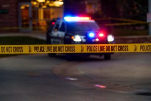 A Fort Collins Police Services car drives to the edge of the barricade tape around Colorado State University's Newton Plaza Oct. 12. Newton Plaza and the surrounding buildings were blocked off following an officer-involved shooting in the Microbiology Building. 