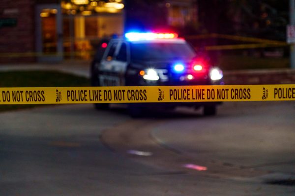 A Fort Collins Police Services car drives to the edge of the barricade tape around Colorado State University's Newton Plaza Oct. 12. Newton Plaza and the surrounding buildings were blocked off following an officer-involved shooting in the Microbiology Building. 