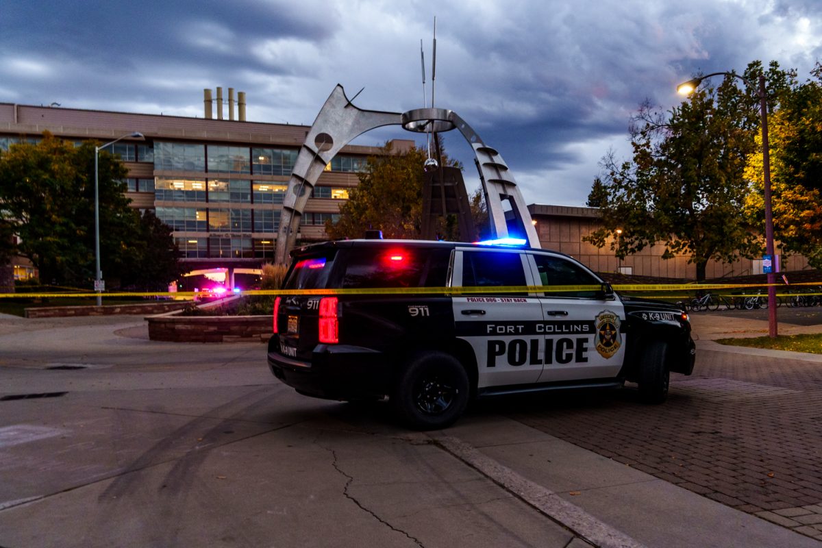 A Fort Collins Police Services car sits parked at the edge of the barricade tape around Colorado State University's Newton Plaza Oct. 12. Newton Plaza and the surrounding buildings were blocked off following an officer involved shooting in the Microbiology Building. 