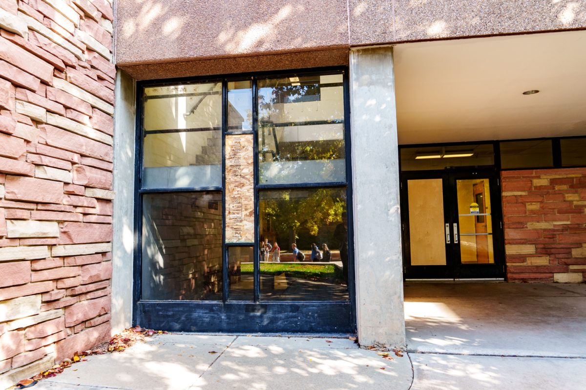 The Colorado State University Microbiology Building's window is boarded up after an officer-involved shooting Oct. 12. 