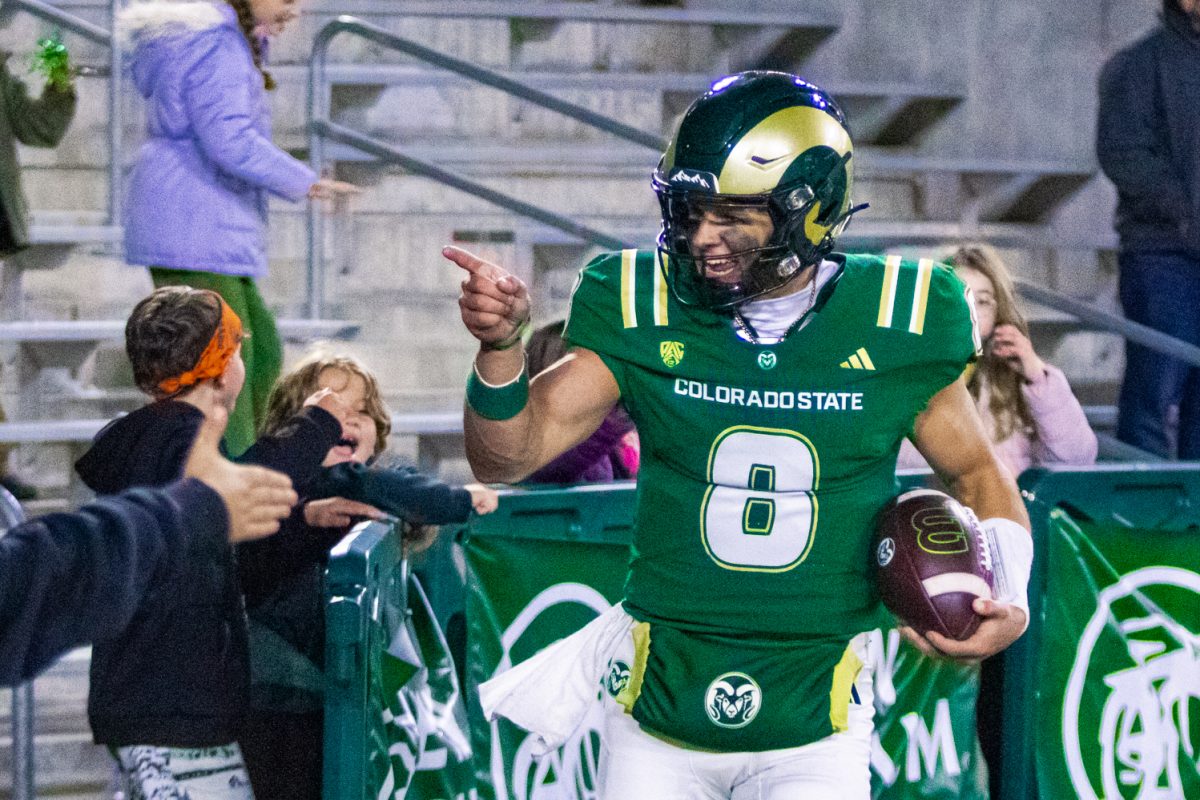 Hauss Hejny (8), quarterback for the Colorado State University football team, points at the crowd behind the north end zone in Canvas Stadium after scoring a touchdown against San Diego State University Oct. 24. Hejny threw for 333 yards, including 3 touchdown passes, leading the Rams to a 56-49 victory over the Aztecs.