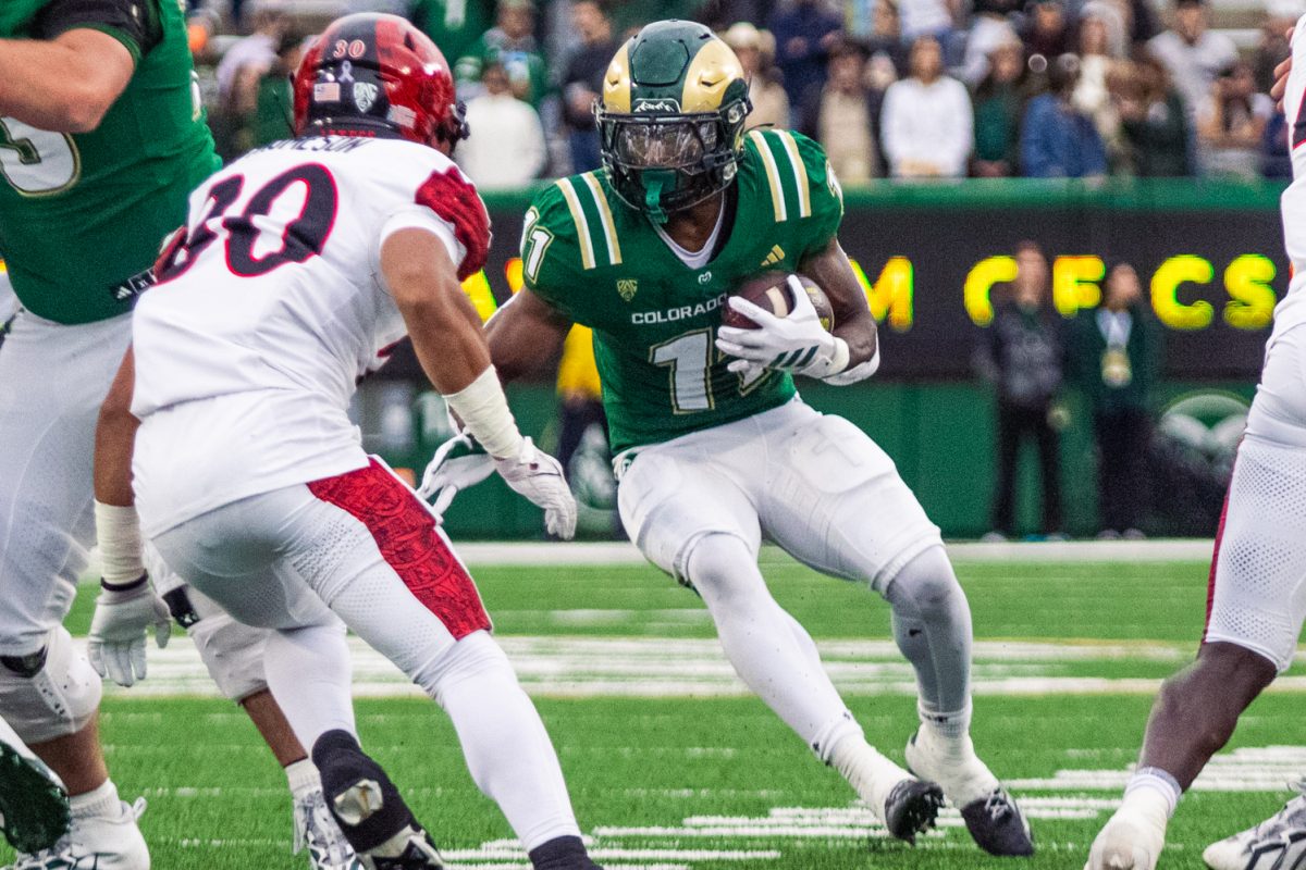 Durell Robinson (11), a running back on the Colorado State University football team, faces off against San Diego State University defense during a home football game in Canvas stadium Oct. 24. Robinson rushed for 86 yards and scored 2 touchdowns in the game.