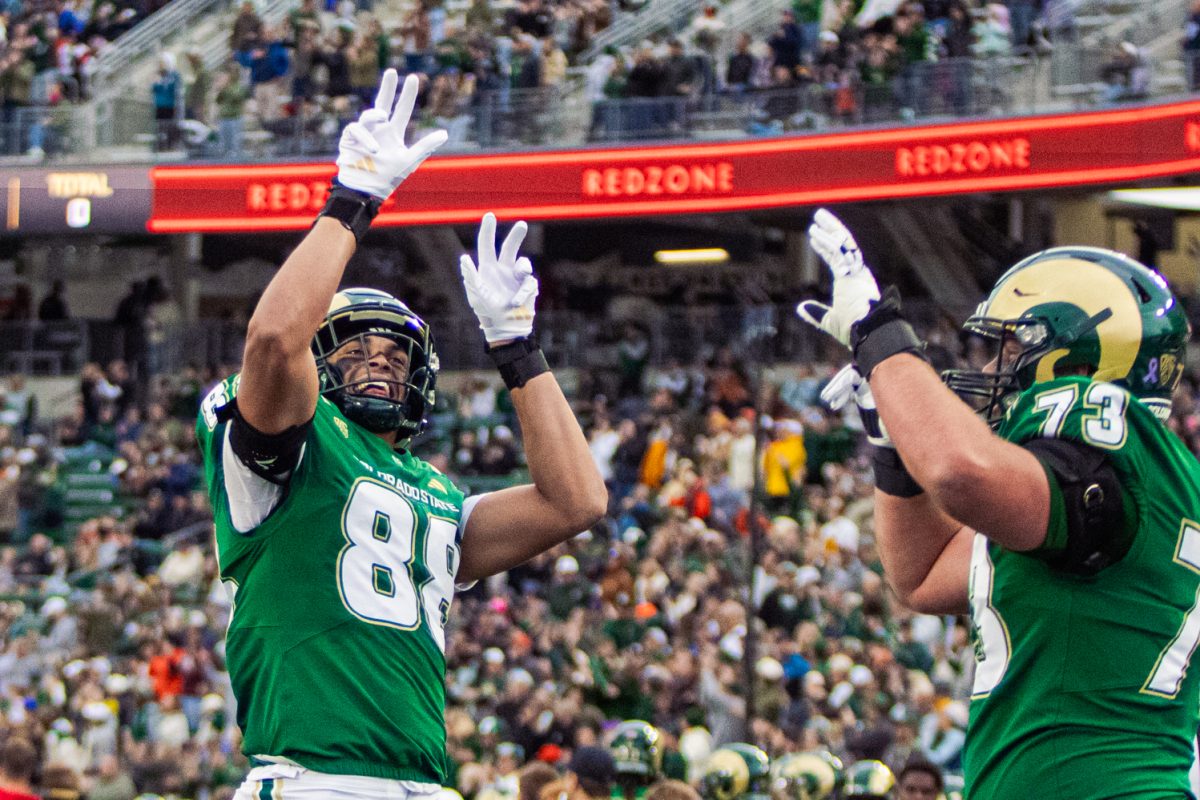 Tight end Nader Chirchi (88) and offensive lineman Braden Hales (73) celebrate a Colorado State University touchdown in the first quarter of the Rams' home matchup against San Diego State University Oct. 24. After losing four games back to back, CSU football secured a win at Canvas Stadium with a final score of 56-49.