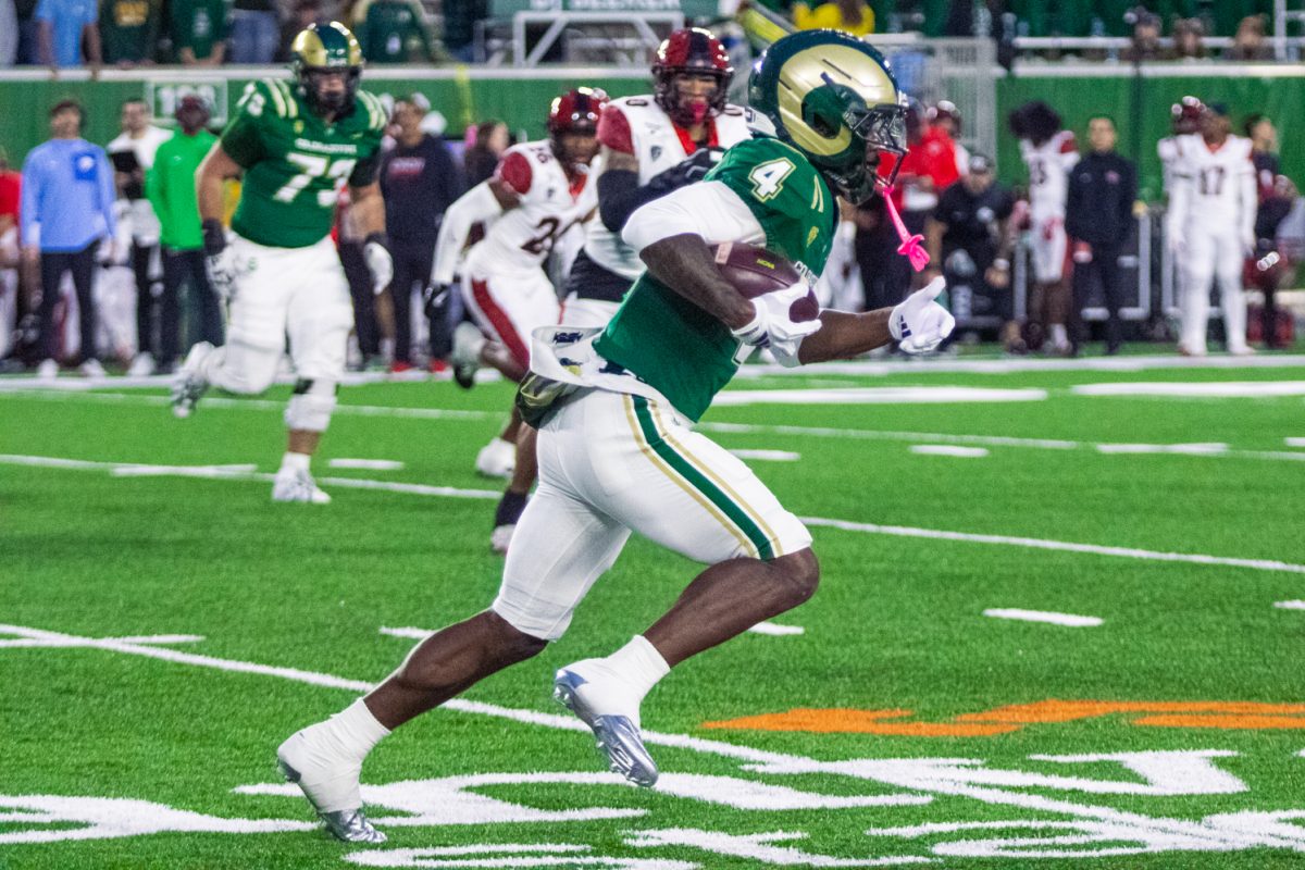 Lavon Brown (4), a Colorado State University wide receiver, runs the ball down the field during CSU's football game against the San Diego State University Aztecs Oct. 24. Brown caught an 8 yard pass from quarterback Hauss Hejny (8) and ran the ball 11 yards to convert to first down.