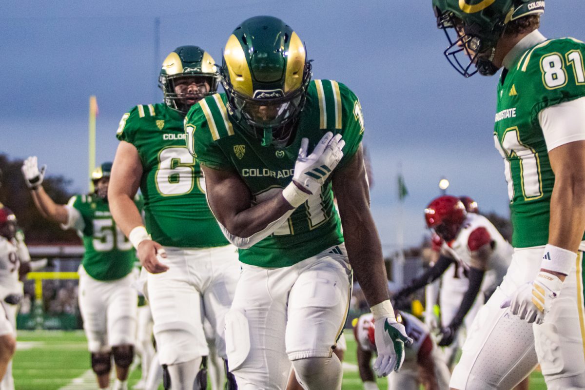 Durell Robinson (11) celebrates a touchdown during Colorado State University's football game against San Diego State University Oct. 24. The running back scored two touchdowns and rushed for 47 yards in the first half of the game. 