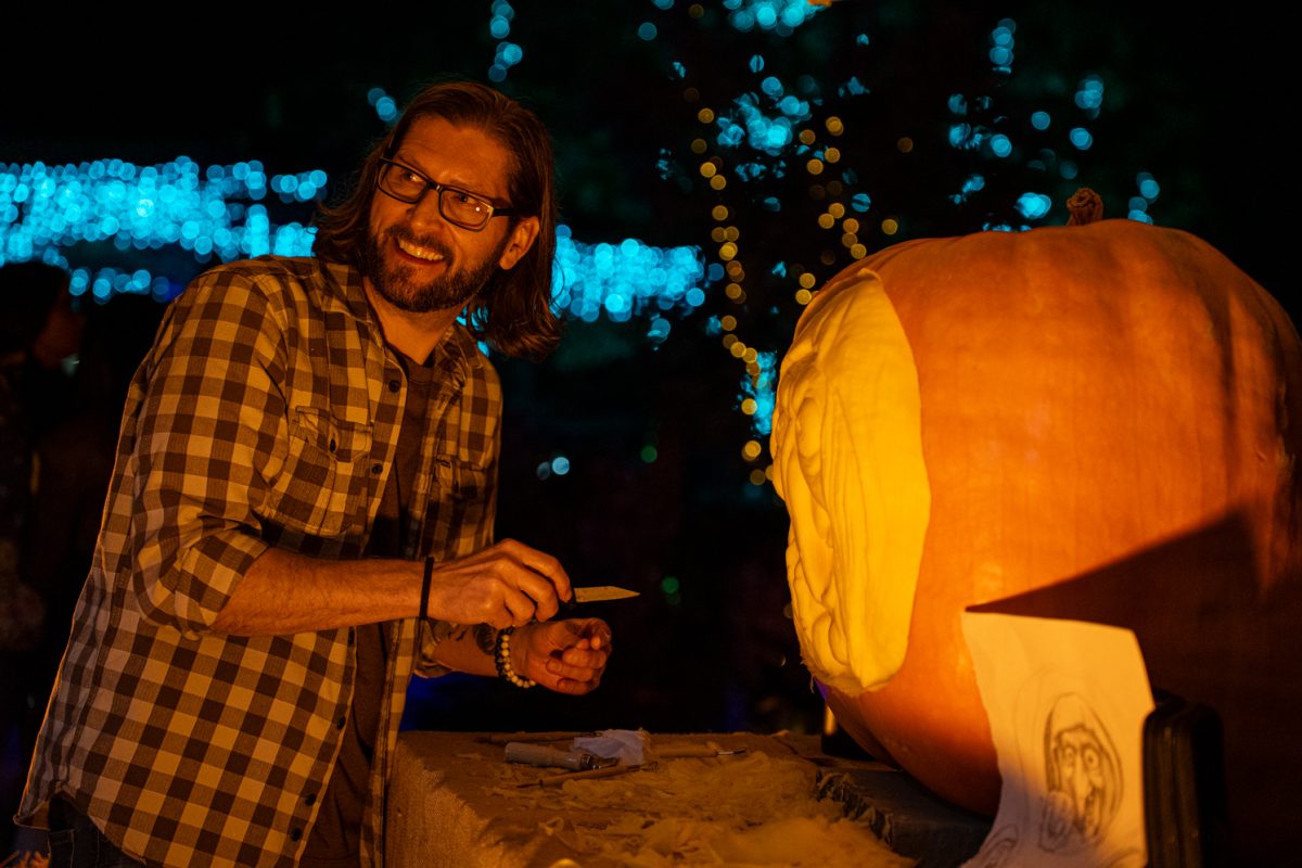 Grant Smith The City Of Fort Collins Creative Director, smiles while he performs live pumpkin carving at "Pumpkins on Parade" located at The Gardens in Fort Collins, Colorado Oct. 22. Smith is Carving Little Timmy the 250 pound pumpkin, which was grown by Tim Hanauer from Fort Collins, CO.
