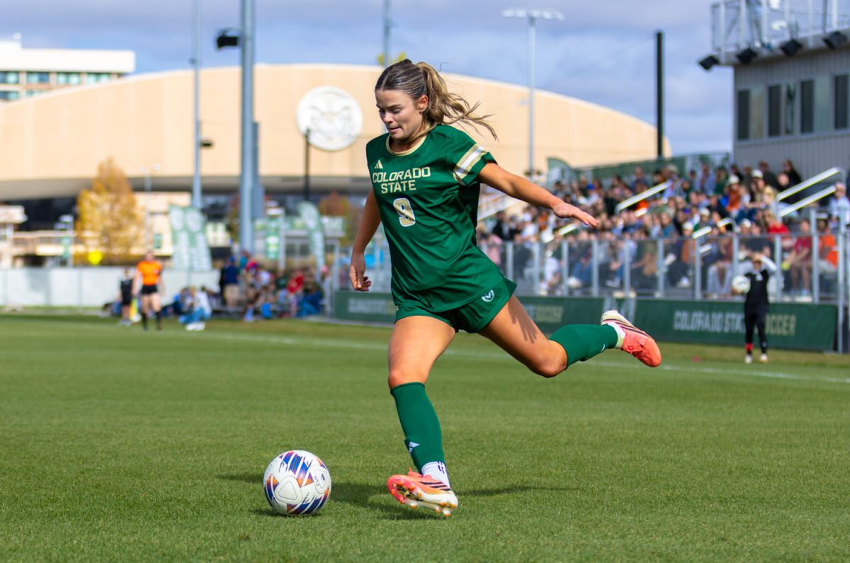 Colorado State University forward Poppy O'Brien (9) centers the ball during CSU's game against Washington State University Oct. 31. CSU won the game 2-1.