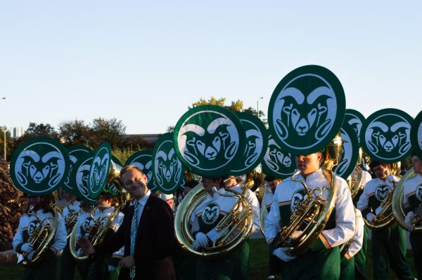Sousaphone players in the Colorado State University Marching Band prepare to play for CSU students and families gathered on the Lory Student Center's West Lawn Oct. 2. 