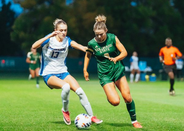 Colorado State University freshman Poppy O'Brien (9) dribbles the ball around Boise State University's Francesca McGuire (13) at CSU's Soccer Field Oct. 22. CSU tied BSU 0-0.