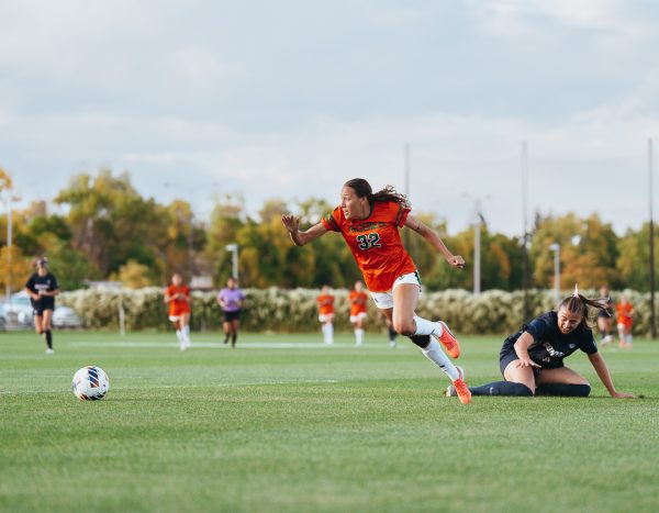 Kaja Dionne (32), a forward for Colorado State University soccer team, dribbles the ball after a Gonzaga University player attempts a slide tackle Oct. 8. CSU won 1-0.